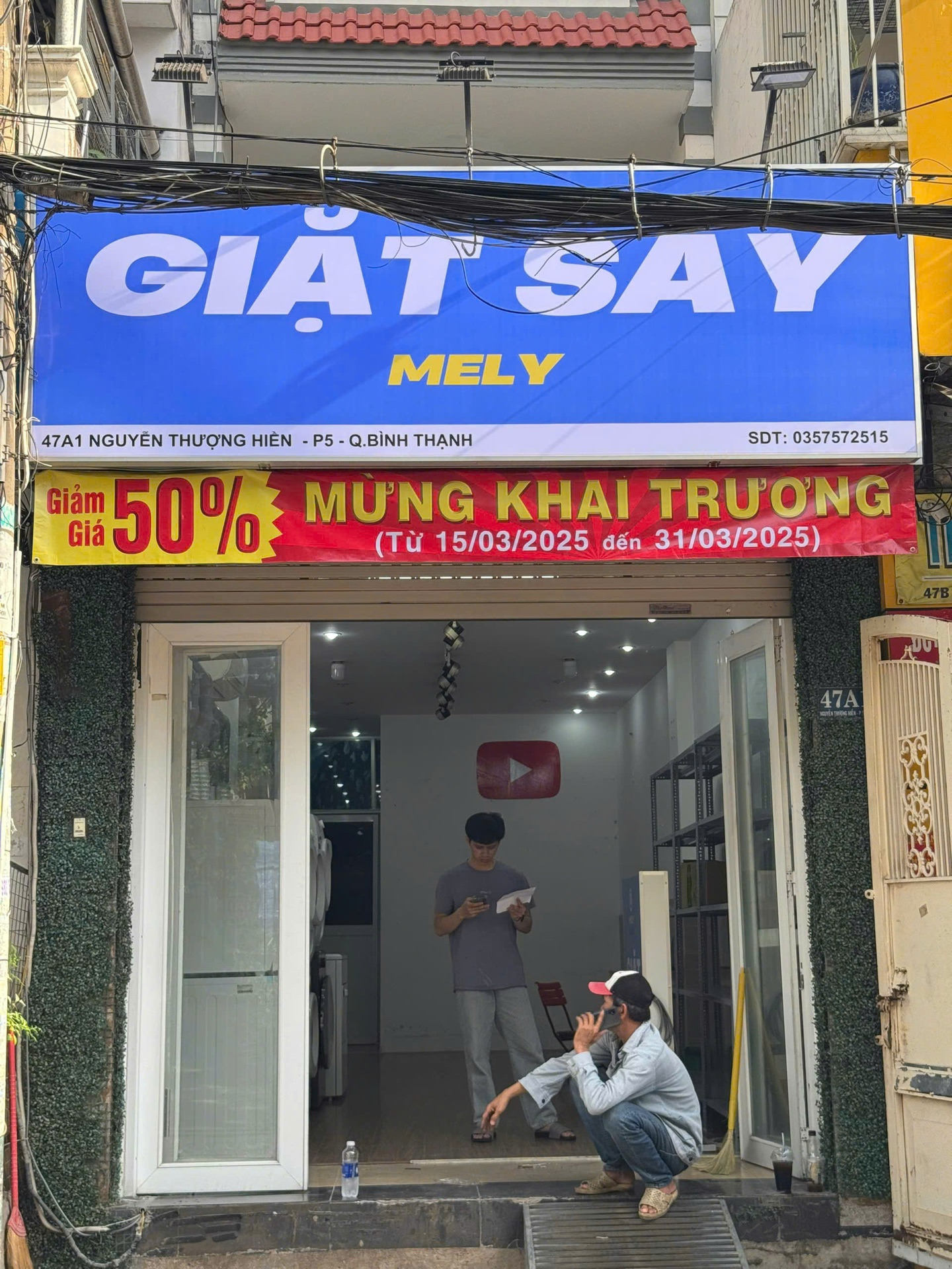 Bảng hiệu Giặt Sấy Mely hoàn thiện tại mặt tiền